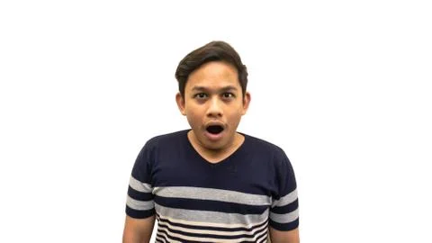 Wow and surprised face expression with opened mouth of young Asian Malay man Stock Photos