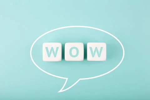 Wow speech bubble on bright blue background Stock Photos