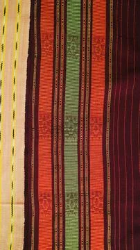 Wowen textile with unique pattern from Indonesia, textured fabric background Stock Photos