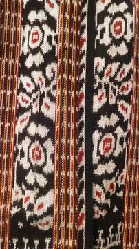 Wowen textile with unique pattern from Indonesia, textured fabric background Stock Photos
