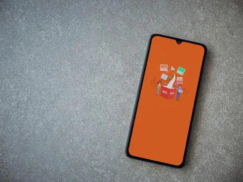 WPS Office app launch screen with logo on the display of a black mobile smart Stock Photos