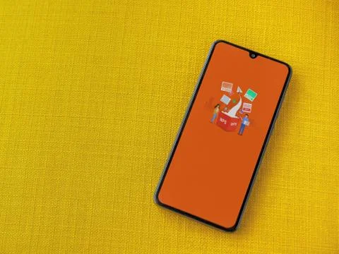 WPS Office app launch screen with logo on the display of a black mobile smart Stock Photos
