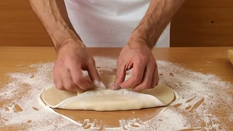 Wrap butter in dough. Stock Footage 77222873