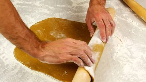 Wrap pastry around rolling pin. Making Christmas Gingerbread Cookies. Stock Footage 77225911