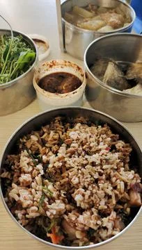 Wrap rice to work, cook it in the evening and share it for breakfast Stock Photos
