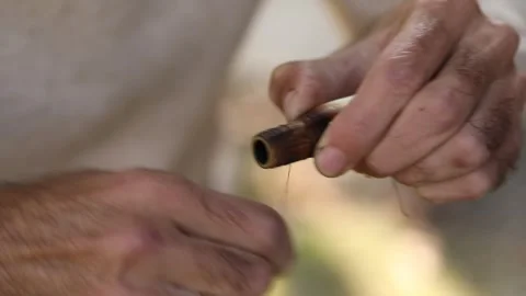 To wrap a thread around wood 1 Stock Footage 324813621
