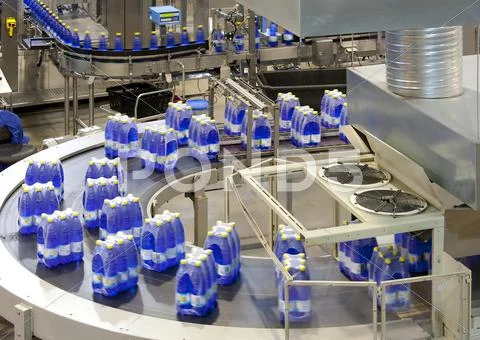 Wrapped Bottles On Production Line In Bottling Plant