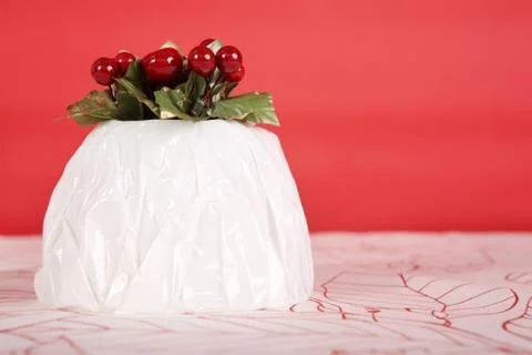 Wrapped christmas pudding Stock Photos