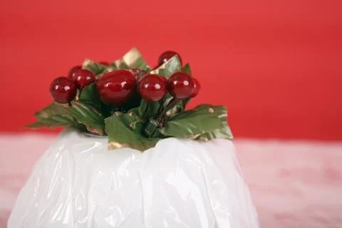 Wrapped christmas pudding Stock Photos