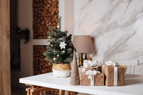 Wrapped in craft paper present boxes on table closeup and beautiful holdiay Stock Photos