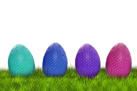 Wrapped Easter eggs on grass Stock Photos