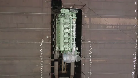 Wrapped engine on rust deck of old repairing fishing vessel Stock Footage 158943318