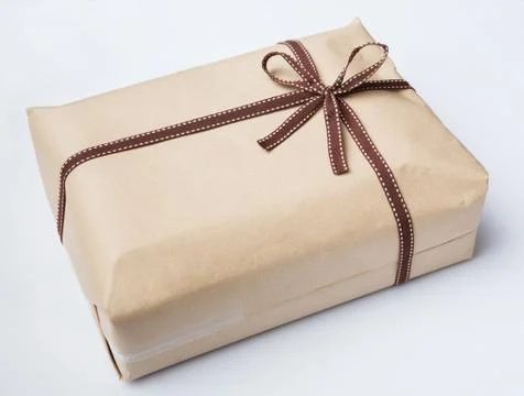 Wrapped gift box and bow tie Stock Photos