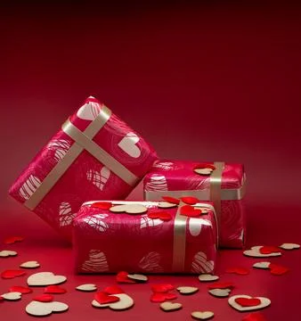 Wrapped gift boxes isolated on a red background Stock Photos