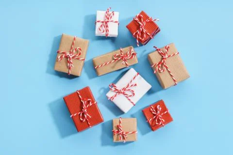 Wrapped gift boxes on light blue background. Stock Photos