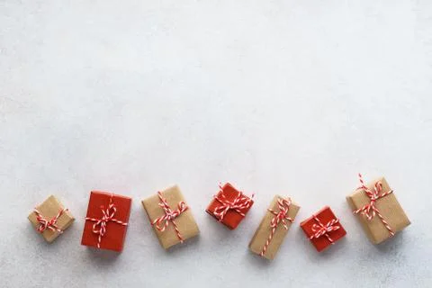 Wrapped gift boxes on light gray background. Seasonal sale. Stock Photos