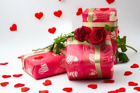 Wrapped gift boxes with roses Stock Photos
