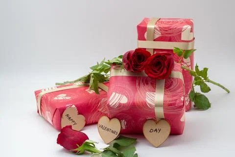 Wrapped gift boxes with roses Stock Photos