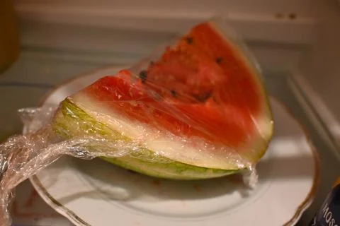 Wrapped slice of watermelon 스톡 사진