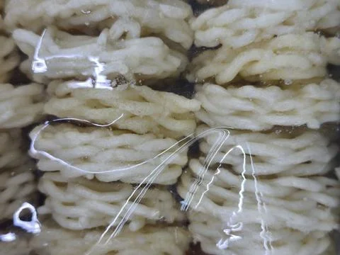 Wrapped stacks of white bread loaves. 库存照片