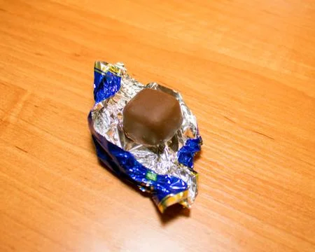 Wrapper and chocolate candy Stock Photos