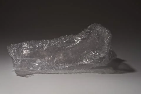 Wrapping bubble wrap on gray background Stock Photos