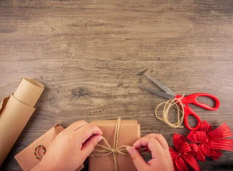 Wrapping Christmas gifts  Stock Photos