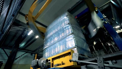 Wrapping container full of spring water bottle. industry factory food and Video stock 334588354