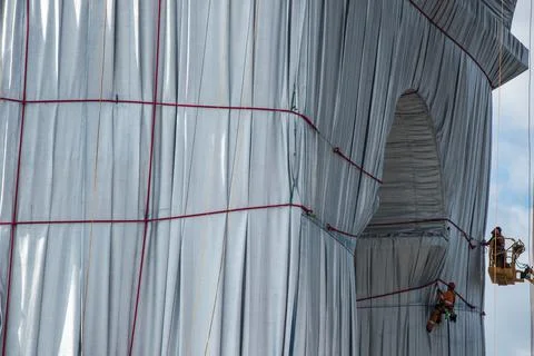 Wrapping of landmark Arc de Triomphe monument in Paris, France - 16 Sep 2021 Stock Photos