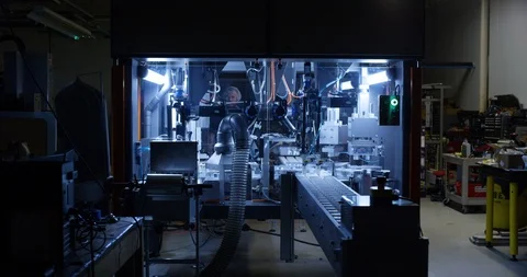 Wrapping machine in a chocolate factory Stock Footage 104000328