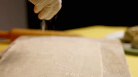 Wrapping puff dough for Wellington beef. 4k video Stock Footage 156301372