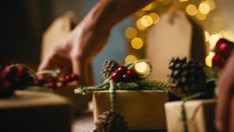 Wrapping Rustic Christmas Gifts under Tree Stock Footage 320290955