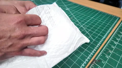 Wrapping Super8 film cartridge for developing 動画素材 319981845