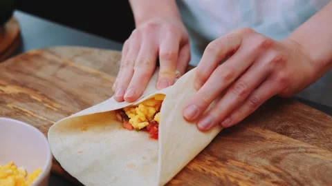 Wrapping a tortilla on the kitchen Stock-Footage 252401298