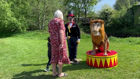 Wray UK. 2025 April, 30; Riverside Scarecrow Lion Tamer and Lion on  display Stock Footage 308151128