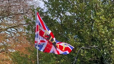 Wray, UK. 2025 April 30th; VE Victory in Europe celebration flag Stock Footage 308083673