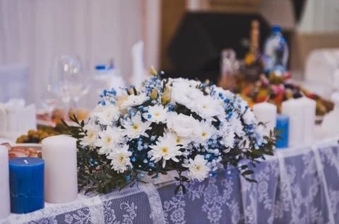 A wreath of daisies on the table 8086. Stock Photos