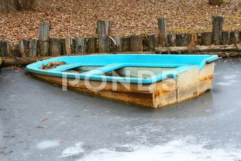 Wreck of a boat blocked by ice Stock Photos