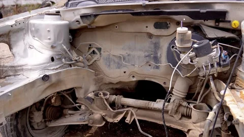Wrecked car chassis without engine at junkyard Stock-Footage 340264280