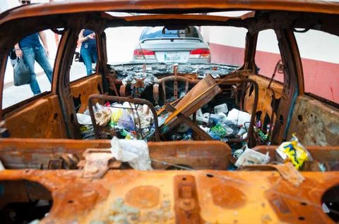 Wrecked Car With Garbage Inside Stock Photos