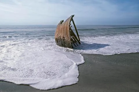 Wrecked Dhow on a beach Stock Photos