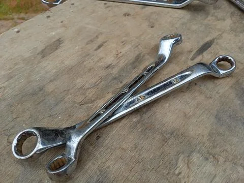Wrench on floor background. Stock Photos