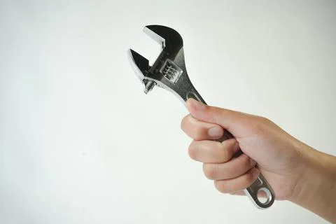 Wrench in hand Foto stock
