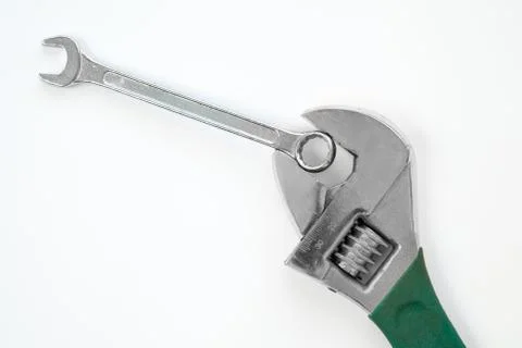Wrench holds spanner Stock Photos