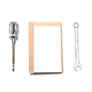 Wrench notebook screwdriver Stock Photos