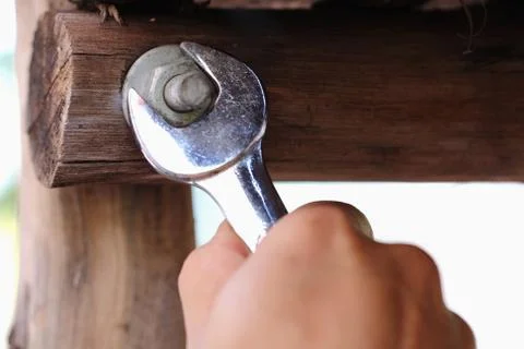 Wrench tighten the nut on use Stock Photos