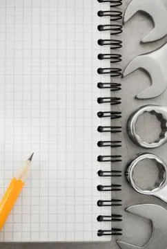 Wrench tools and notebook Stock Photos