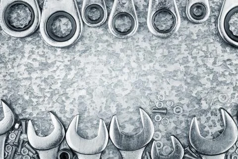 Wrenches and tools framing a metallic background Stock Photos