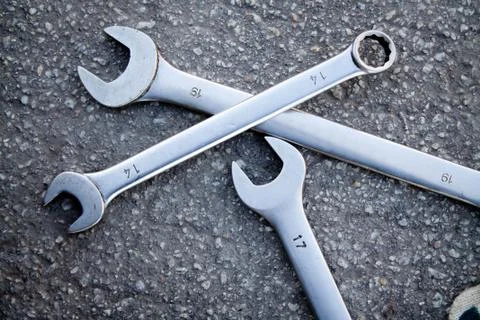 Wrenches on a background of asphalt Stock Photos