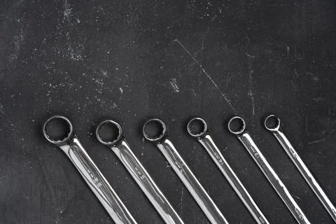 Wrenches on black background with copy space, steel hand working tools Stock Photos